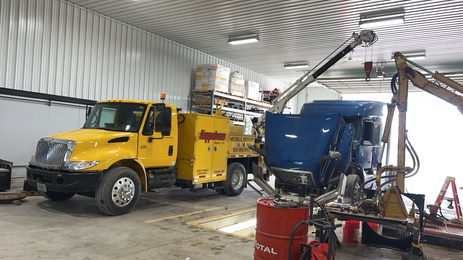 Service truck working on a truck in the shop